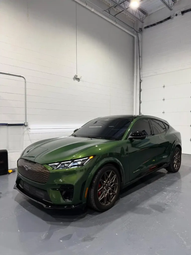 Dark green SUV after window tinting service in Clinton Township