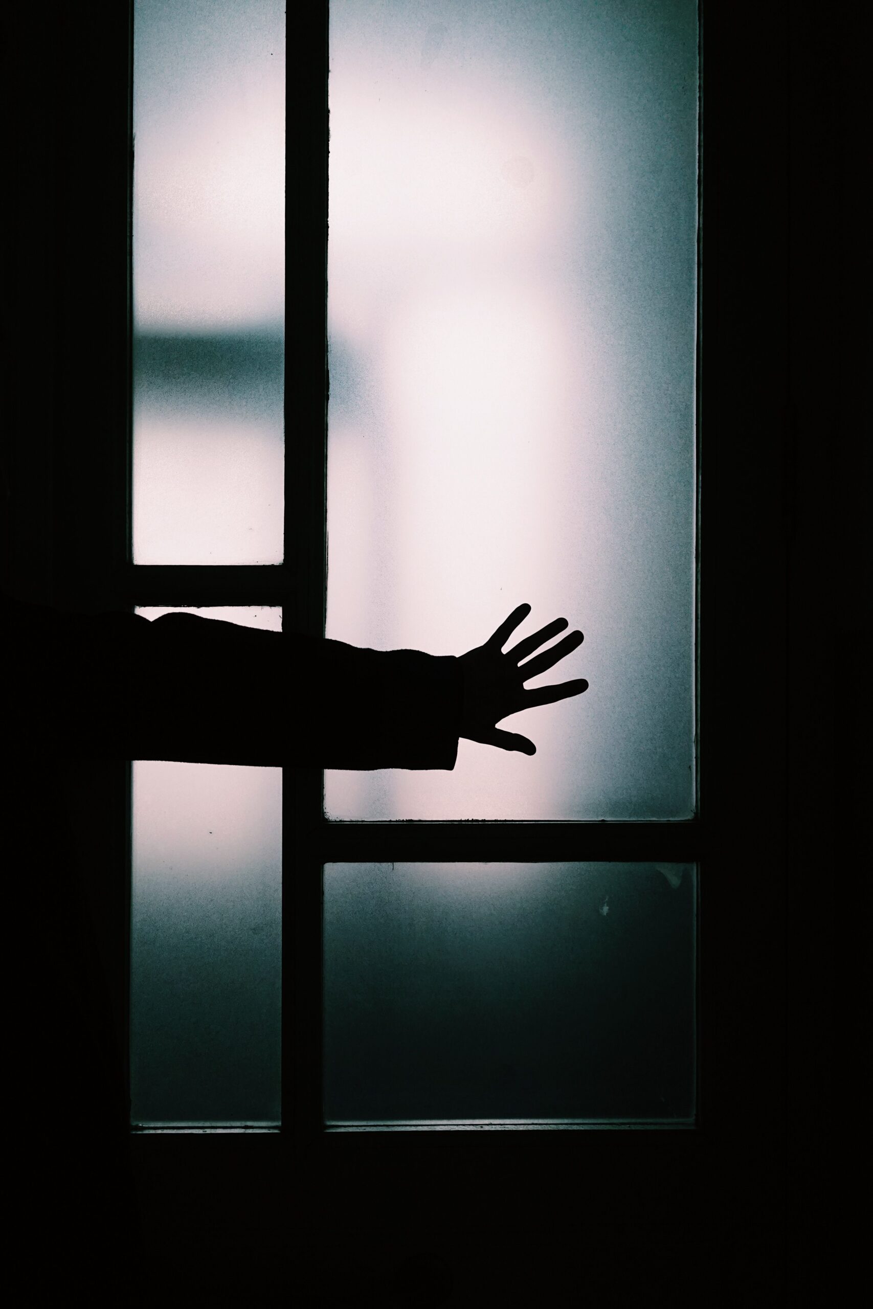 Picture of hands on frosted windows